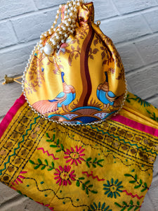 Traditional Yellow Celebration Dupatta with Colorful Floral Embroidery and Elegant Yellow Peacock Print Potli Bag with Pearl Handle